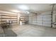 Spacious garage offers ample storage with shelving and plenty of room for parking and projects at 2340 W Myrtle Dr, Chandler, AZ 85248