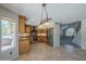 Charming kitchen features wooden cabinetry, tile backsplash, stainless steel appliances, and a window view at 2340 W Myrtle Dr, Chandler, AZ 85248