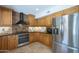 Well-equipped kitchen with stainless steel appliances, granite countertops, and tiled backsplash at 2340 W Myrtle Dr, Chandler, AZ 85248