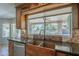 Updated kitchen with wood cabinets, granite countertops, copper sink, stainless appliances, and backyard views at 2340 W Myrtle Dr, Chandler, AZ 85248
