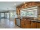 Updated kitchen with wood cabinets, granite countertops, stainless appliances, and backyard view at 2340 W Myrtle Dr, Chandler, AZ 85248