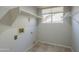 Practical laundry room with shelving, tile flooring and a window at 2340 W Myrtle Dr, Chandler, AZ 85248