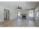 Spacious living room features a fireplace, neutral paint, tile flooring and ample natural light at 2340 W Myrtle Dr, Chandler, AZ 85248