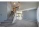 Inviting living room with a staircase and large windows providing ample natural light at 2340 W Myrtle Dr, Chandler, AZ 85248