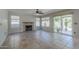 Bright living room with neutral paint, tile flooring, fireplace, and sliding glass door to backyard at 2340 W Myrtle Dr, Chandler, AZ 85248