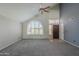 Bright living room with high ceilings, ample natural light, and neutral carpeting, perfect for entertaining at 2340 W Myrtle Dr, Chandler, AZ 85248