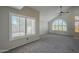 Bright, open living room featuring plantation shutters, a ceiling fan, and ample natural light at 2340 W Myrtle Dr, Chandler, AZ 85248