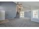 Open living room showcases a vaulted ceiling, staircase, and bright windows with white shutters at 2340 W Myrtle Dr, Chandler, AZ 85248