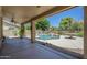Backyard patio and refreshing in-ground pool with mature trees at 2340 W Myrtle Dr, Chandler, AZ 85248