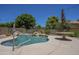 Backyard pool area with rock waterfall feature and desert landscaping provides a serene outdoor living space at 2340 W Myrtle Dr, Chandler, AZ 85248