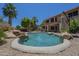 Inviting backyard pool features rock details and desert landscaping, offering a private and refreshing outdoor space at 2340 W Myrtle Dr, Chandler, AZ 85248