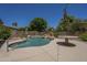 Inviting pool with custom rock waterfall at 2340 W Myrtle Dr, Chandler, AZ 85248
