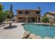 Pool with rock accents and large patio area outside the two-story home with ample space for outdoor seating at 2340 W Myrtle Dr, Chandler, AZ 85248