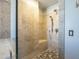 Walk-in shower showcases pebble flooring, a built-in bench, and a hand-held shower head at 2340 W Myrtle Dr, Chandler, AZ 85248