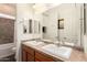 Bathroom featuring double sinks, tile floors, and a full bathtub and shower at 24013 N 165Th Ave, Surprise, AZ 85387