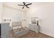 Clean bedroom featuring an un-assembled grey bedframe, dresser, and neutral carpet at 24013 N 165Th Ave, Surprise, AZ 85387