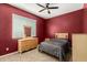 Bedroom features a window, neutral paint, carpeting, and natural wood furnishings at 24013 N 165Th Ave, Surprise, AZ 85387