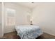 Bright bedroom featuring a window, neutral paint, and plush carpeting at 24013 N 165Th Ave, Surprise, AZ 85387