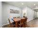 Dining room with a wooden table and chairs, complemented by modern wall decor at 24013 N 165Th Ave, Surprise, AZ 85387