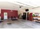Spacious garage with tools and a painted wall, offering ample storage and workspace at 24013 N 165Th Ave, Surprise, AZ 85387