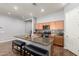 Modern kitchen with a large center island, wooden cabinets, and stainless steel appliances at 24013 N 165Th Ave, Surprise, AZ 85387