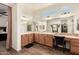 Beautiful primary bath featuring a spacious vanity area with dual mirrors and sinks at 24013 N 165Th Ave, Surprise, AZ 85387
