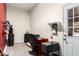 Functional bonus room with a desk, water softener, tire rack and access to the garage at 24013 N 165Th Ave, Surprise, AZ 85387