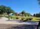Picturesque park featuring a playground, walking path, and landscaped grounds at 24013 N 165Th Ave, Surprise, AZ 85387