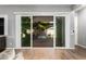 View of covered patio through sliding glass doors from the living area at 24013 N 165Th Ave, Surprise, AZ 85387