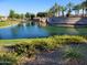 Scenic pond with landscaping, fountain, and Ajante community sign at 24013 N 165Th Ave, Surprise, AZ 85387