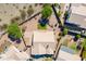 Aerial view of a single-story home with a neutral paint scheme, tile roof, and mature landscaping in a desert community at 2422 E Rockledge Rd, Phoenix, AZ 85048