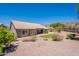 Backyard featuring desert landscaping, partial mountain views, and covered patio at 2422 E Rockledge Rd, Phoenix, AZ 85048