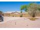 A well maintained backyard with gravel, mature landscaping, privacy wall, and a concrete patio at 2422 E Rockledge Rd, Phoenix, AZ 85048