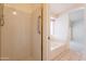 Accessible walk-in shower and soaking tub, perfect for those seeking a relaxing retreat at 2422 E Rockledge Rd, Phoenix, AZ 85048