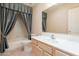 Bathroom features a single vanity with shower/tub combo with modern fixtures at 2422 E Rockledge Rd, Phoenix, AZ 85048