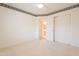 Cozy bedroom features a walk-in closet, doorway, and soft carpet creating a comfortable retreat at 2422 E Rockledge Rd, Phoenix, AZ 85048