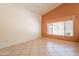 Cozy bedroom with tile flooring, neutral paint, and window that fills the room with natural light at 2422 E Rockledge Rd, Phoenix, AZ 85048