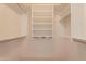 Well-organized walk-in closet with adjustable shelving, maximizing storage and convenience at 2422 E Rockledge Rd, Phoenix, AZ 85048