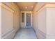 Covered entryway with decorative pillars and a security screen door at 2422 E Rockledge Rd, Phoenix, AZ 85048