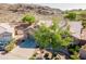 Aerial view of a single-story home with a neutral paint scheme, tile roof, mature landscaping, and a two-car garage at 2422 E Rockledge Rd, Phoenix, AZ 85048