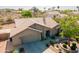 Aerial view of a single-story home with a neutral paint scheme, tile roof, mature landscaping, and a two-car garage at 2422 E Rockledge Rd, Phoenix, AZ 85048