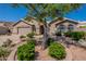 Charming single-story home featuring a well-manicured front yard and a two-car garage at 2422 E Rockledge Rd, Phoenix, AZ 85048