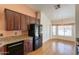 Well-lit kitchen with granite countertops, cherry cabinets, and stainless steel appliances at 2422 E Rockledge Rd, Phoenix, AZ 85048