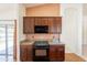 Kitchen featuring cherry cabinets, stainless steel appliances, granite countertops, and hardwood floors at 2422 E Rockledge Rd, Phoenix, AZ 85048
