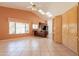 Living room has tile flooring, lots of windows, and access to a kitchen area at 2422 E Rockledge Rd, Phoenix, AZ 85048