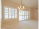 Bright living room with white shutters on windows and a sliding glass door at 2422 E Rockledge Rd, Phoenix, AZ 85048