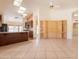 Open-concept living room with custom built-in cabinets and tile flooring throughout main living space at 2422 E Rockledge Rd, Phoenix, AZ 85048