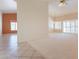Bright living room with neutral carpeting and abundant natural light from large windows at 2422 E Rockledge Rd, Phoenix, AZ 85048