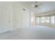 Large primary bedroom has a bay window, ceiling fan and connects to ensuite bathroom at 2422 E Rockledge Rd, Phoenix, AZ 85048