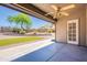 Covered patio overlooks a landscaped backyard and features a ceiling fan at 2422 E Rockledge Rd, Phoenix, AZ 85048